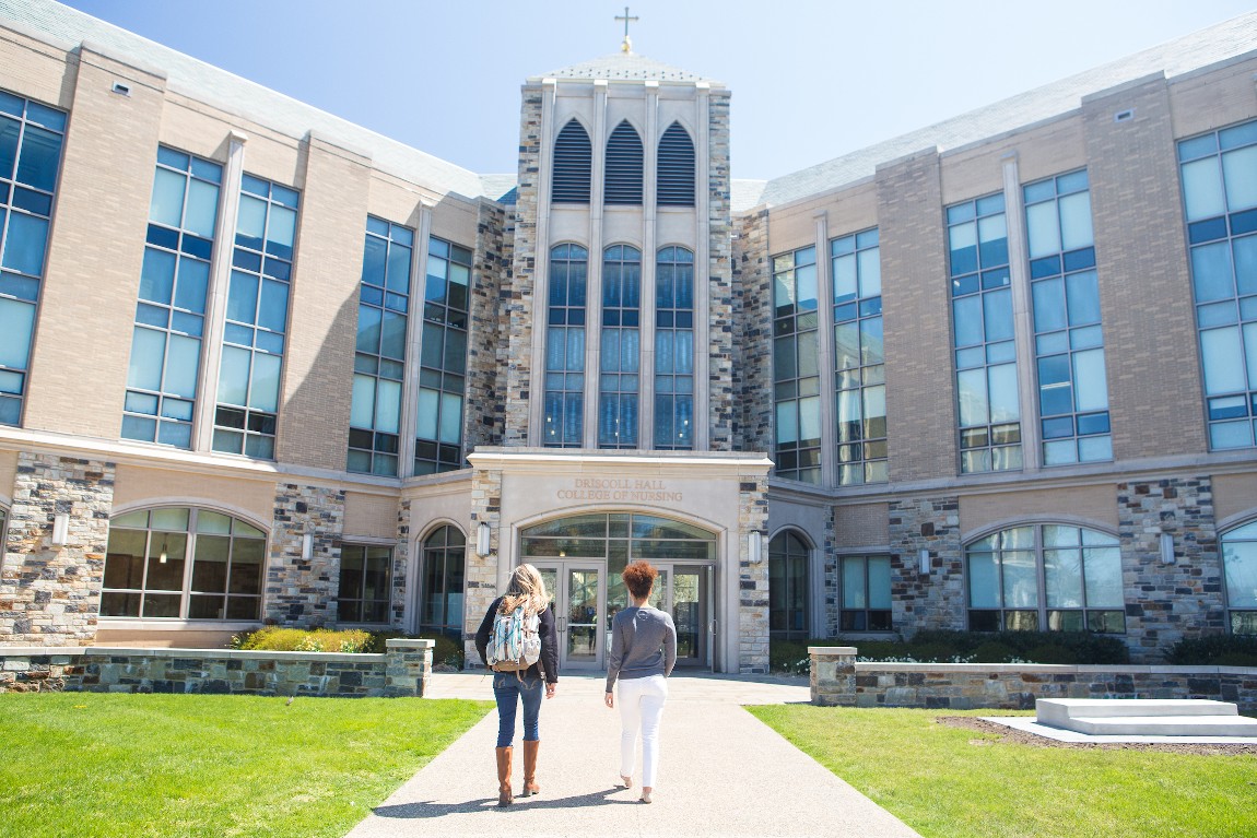 Two students walk toward Villanova University's Fitzpatrick College of Nursing.